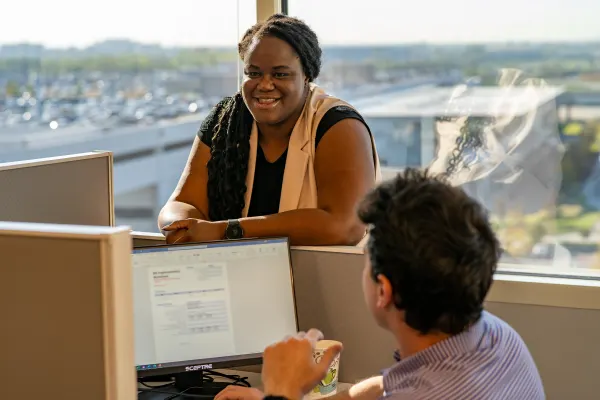 Two colleagues are discussing employee benefits.